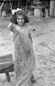 Working of Hemp, Little Girl with Bundle of Fibers