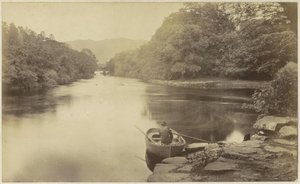 River Landscape in England, with a Man in a Rowboat in the Foreground by Anonymous