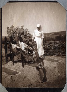 First World War 1914-1918: nurse (Therese Pavillou?) in a blouse on the grave of French pilot sergeant Roux, who died at the age of 21, at Couville, Manche, Lower Normandy, France. Anonymous photograph July 1917. Private collection, Stella by Anonymous Anonymous