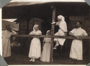 First World War 1914-1918: Nurses and Doctors in Blouse Talking in Couville, Manche, Lower Normandy, France. Anonymous Photograph July 1917. Private Collection, Stella. by Anonymous Anonymous