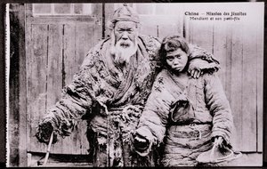 Old beggar with grandson - Early 20th century photograph - Private collection by Anonymous Anonymous
