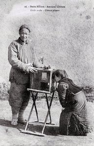 A Traveling Entertainer with an Image Box - Photograph of the Beginning of the 20th Century - Private Collection by Anonymous Anonymous