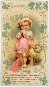 A little boy holding the cross and the crown of thorns, in order to share Jesus