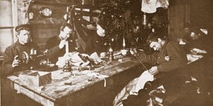 In the Hut during Mid-Winter, the Men Engaged in Sewing Furs for Clothing to be Used in Springtime Sledging, pub. London 1907 by Anthony Fiala