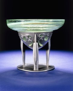 A Liberty Tudric pewter bowl with James Couper & Sons Clutha glass lining, c.1902-05