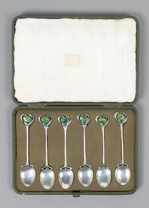 A Boxed Set of Cymric Silver Spoons with Enamelled Finials Designed by Archibald Knox by Archibald Knox