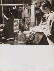 Man in a Lab Using a Large Pipette