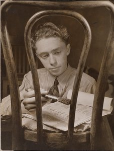 Young Man Paints the Back of a Wooden Chair by Arnold Eagle