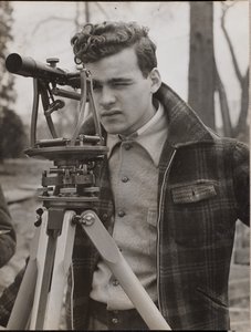 Young Man Peers Through a Surveyor