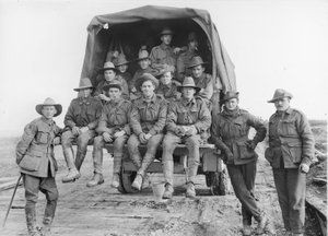 A lorry load of Australian Artillery reinforcements proceeding along the road to join the batteries of the 5th Australian Divisional Artillery, engaged in the battle for the Hindenburg Line Defences by Australian Photographer