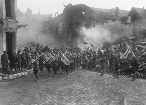 The Band of the 5th Australian Infantry Brigade, Led by Bandmaster Sergeant A Peagam of the 19th Battalion, Passing Through the Grande Place (Town Square) of Bapaume, Playing the Victoria March, Bapaume by Australian Photographer