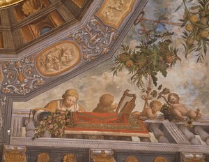 Checkers, musician, and cupids on balcony (detail), Treasury room, Ludovico il Moro Palace, Ferrara, Italy