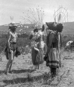 Native American people and tribal roundhouse and ceremonial attire, California
