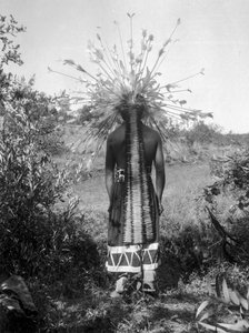 Native American people and tribal roundhouse and ceremonial attire, California
