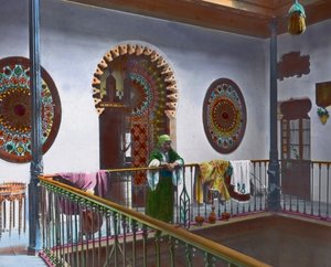 Moroccan woman in gallery, image date: circa 1910, Carl Simon Archive by Carl Simon