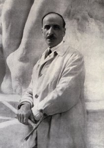 Three-quarter-length portrait of the sculptor Edoardo Rubino with marteline in hand. In the background a sculpture can be made out by Carlo Gherlone