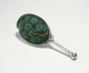 Hand mirror designed by Ashbee with peacock design enamelled by William Mark, made by the guild of Handicraft, 1903