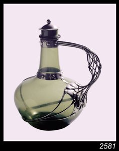 Silver-mounted green glass decanter with makers mark for the Guild of Handicraft, 1901
