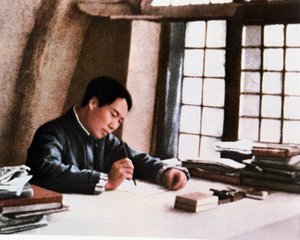 Mao writing his work From Prolonged War in a cave in Yenan by Chinese Photographer