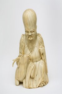 Carved Ivory figure of Shou Xing seated with deer, c.1580-1644 by Chinese School