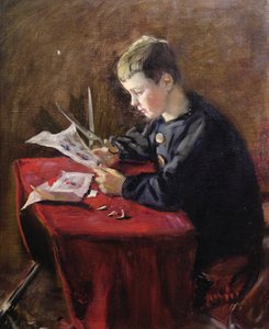 Boy cutting Christmas decorations