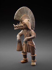 Dancer with crocodile helmet, 300 BC-300 AD by Culture Colima