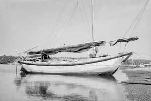 A two-masted Twaqo type junk moored bow-on to the shore at Singapore