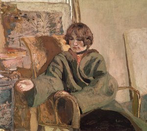Woman seated next to a stove