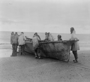 Native Americans launching a whale boat at Cape Prince of Wales, Alaska, c.1929