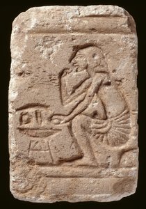 Relief of a man seated beside a table, Amarna Period