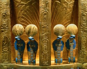 Reverse side of the throne of Pharaoh Tutankhamun with four golden uraeus cobra figures by Egyptian 18th Dynasty