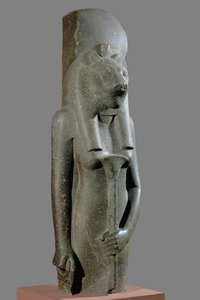 The Goddess Sekhmet holding a sceptre in the form of a papyrus stalk by Egyptian 18th Dynasty