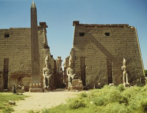Facade and First Pylon with two seated statues of Ramesses II and the remaining obelisk