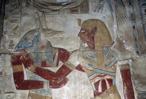 Painted relief depicting Pharaoh and god Anubis, chapel of Osiris, Temple of Seti I