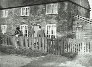 A Rural Scene in the Wandsworth Area with an Elderly Couple in the Garden of a Cottage-Style Property, London, 1895 by English Photographer