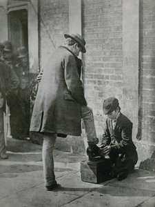 A Young Shoeblack Shining a Man