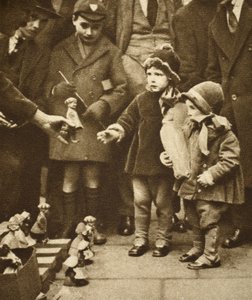 Children crowding round a street hawker, Holborn