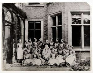 Florence Nightingale with Sir Harry Verney and Miss Crossland, in the centre of a group of nurses at Claydon House, 1886 by English Photographer