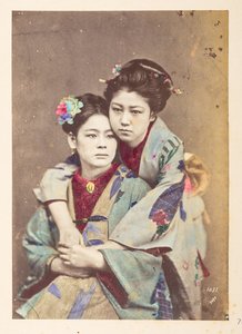 Japanese Women in Traditional Dress, Three-quarter Length Portrait of Two Young Women, One Seated, the Other Leaning Over Her Shoulder with Her Arms Around Her