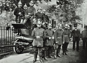 London Fire Brigade: group of firemen, with engine and turncocks by English Photographer