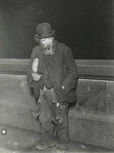 London, Tramp with a Pipe by English Photographer