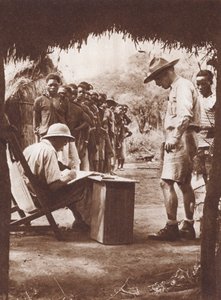 Native workers, queuing to be paid in the African bush by English Photographer