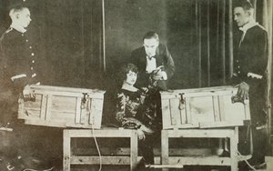 P T Selbit, the British magician, sawing a woman in two by English Photographer