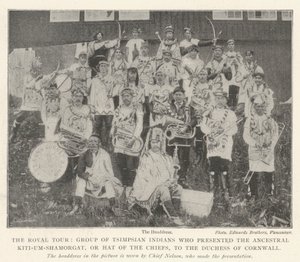The Royal Tour, Group of Tsimpsian Indians who presented the Ancestral Kiti-um-Shamorgat, or Hat of the Chiefs, to the Duchess of Cornwall by English Photographer