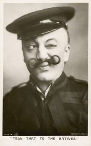 Woman in a uniform and a moustache by English Photographer