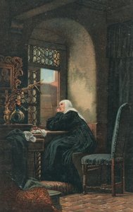 A nun sits in prayer