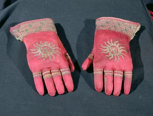 A pair of knitted silk gloves, possibly once belonging to Archbishop William Warham, late 15th or early 16th century