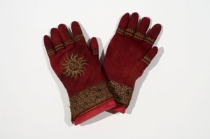 A pair of knitted silk gloves, possibly once belonging to Archbishop William Warham, late 15th or early 16th century