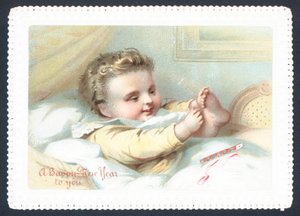 Baby in Bed Playing with Toes by English School