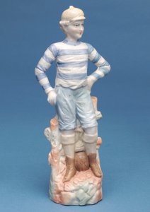 Bisque figure of a boy footballer in blue and white striped kit (ceramic) by English School